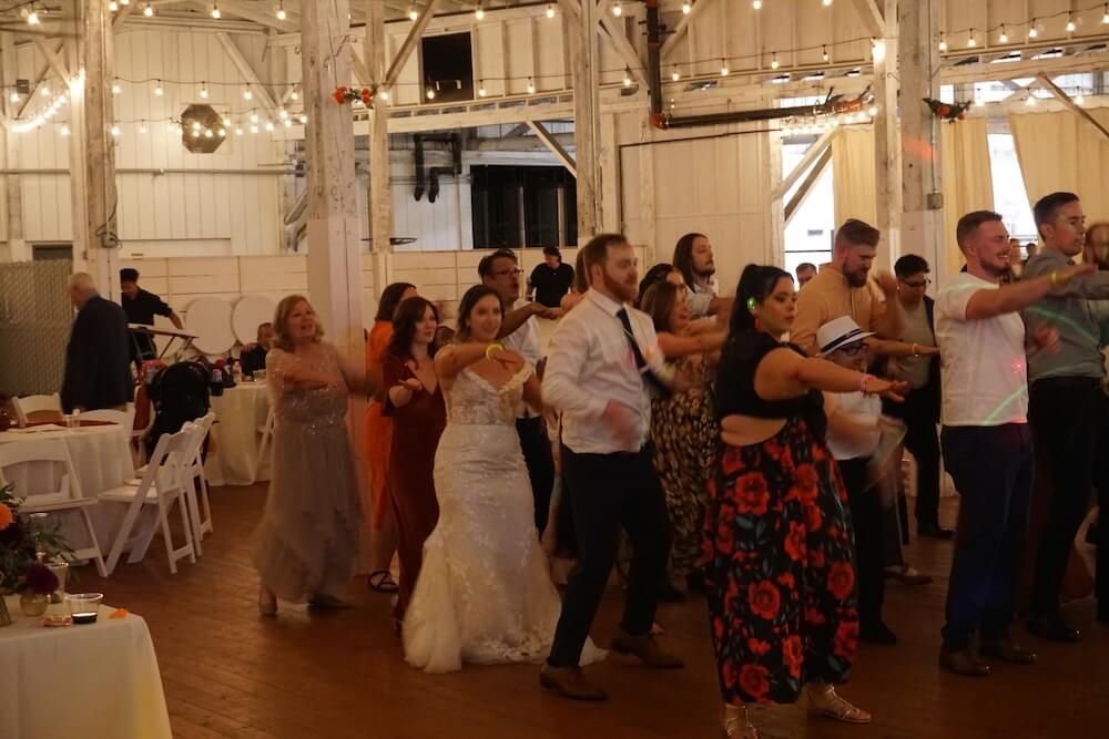 wedding guests dancing to the macarena at a wedding in Tacoma, WA with dj dubreezy